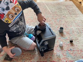 Max playing with the Casdon Delonghi Coffee Machine