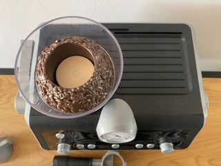 Dropping the coffee pod into the top of the Casdon Delonghi Coffee Machine