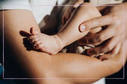 Close up of parent holding their baby